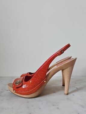 CHRISTIAN DIOR: Vibrant Orange Slingback Logo Platform Heels